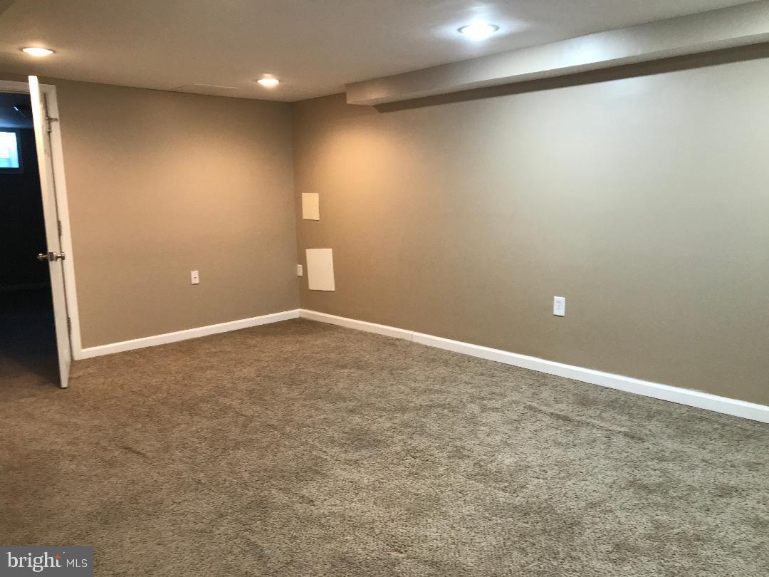 2461 Woodcroft Road Baltimore, MD 21234 - Photo 29 of 33 3rd living room located in basement, lots of space