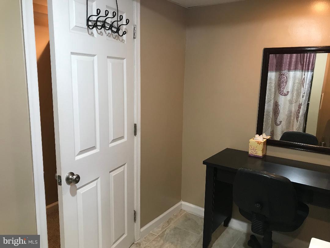 2461 Woodcroft Road Baltimore, MD 21234 - Photo 32 of 33 Well light bathroom with area for make up station