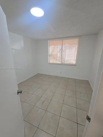 a view of a room with white door