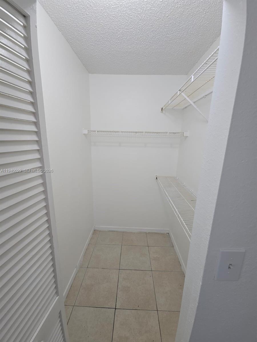 4035 West McNab Road, Unit F210 Pompano Beach, FL 33069 - Photo 16 of 22 a view of a room with white door