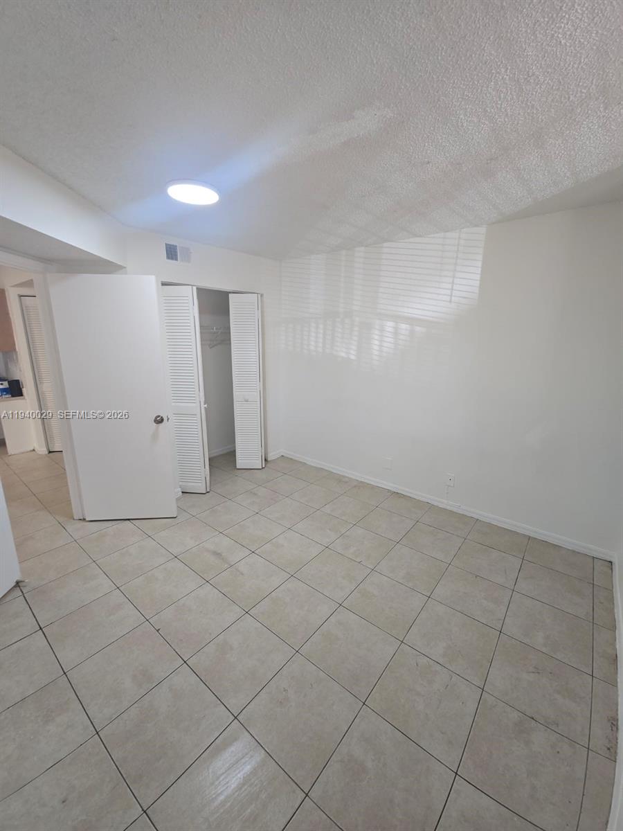 4035 West McNab Road, Unit F210 Pompano Beach, FL 33069 - Photo 17 of 22 a view of an empty room