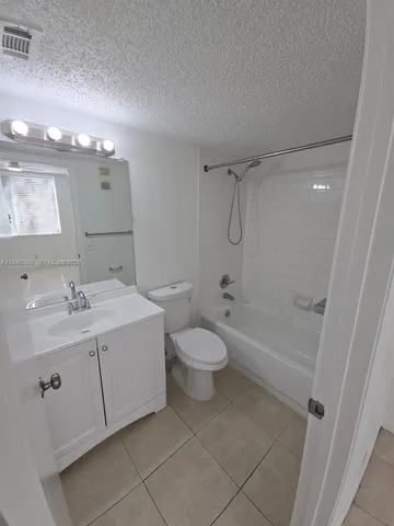 a view of an empty room with a bathroom