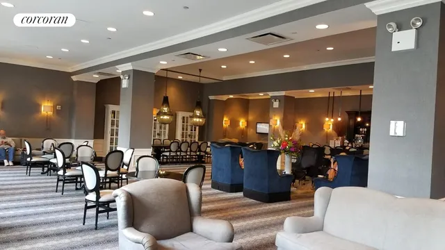 a living room with furniture and dining room