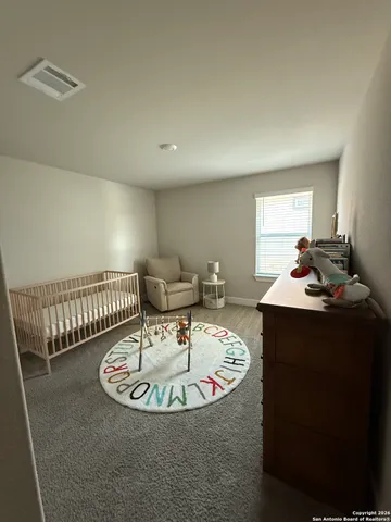 a living room with furniture a table and a chandelier