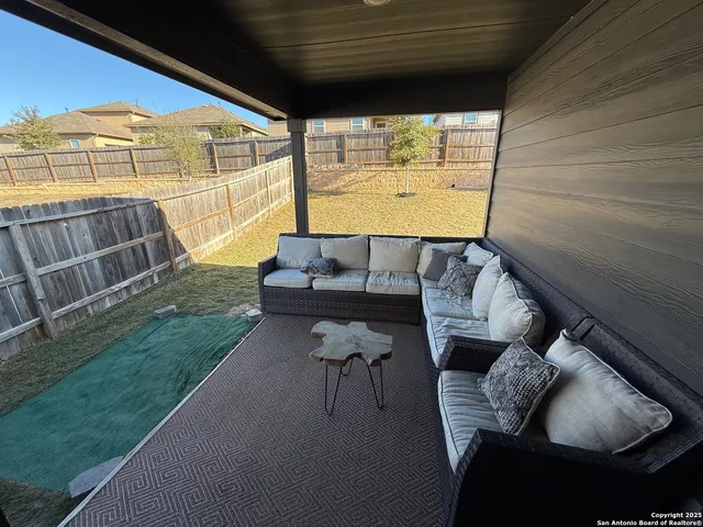 a view of a backyard of the house