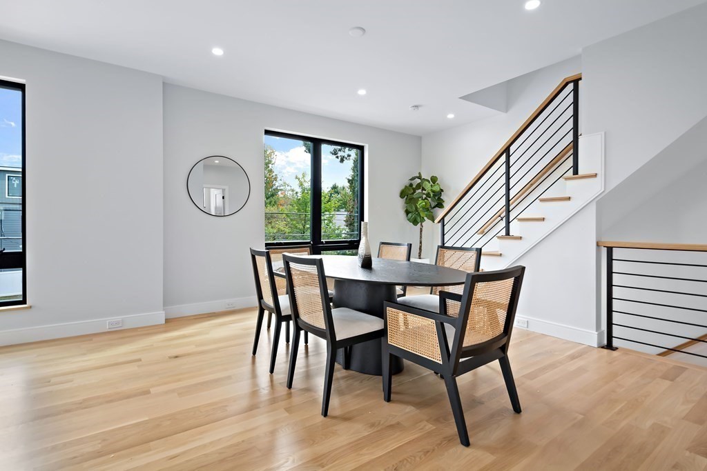 25 Tolman Street, Unit 1 Waltham, MA 02453 - Photo 11 of 36 a view of a dining room with furniture and window