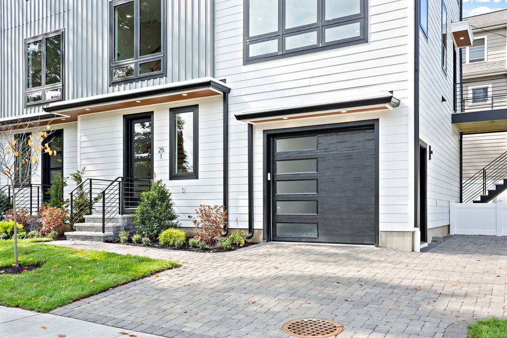 25 Tolman Street, Unit 1 Waltham, MA 02453 - Photo 2 of 36 a front view of a house