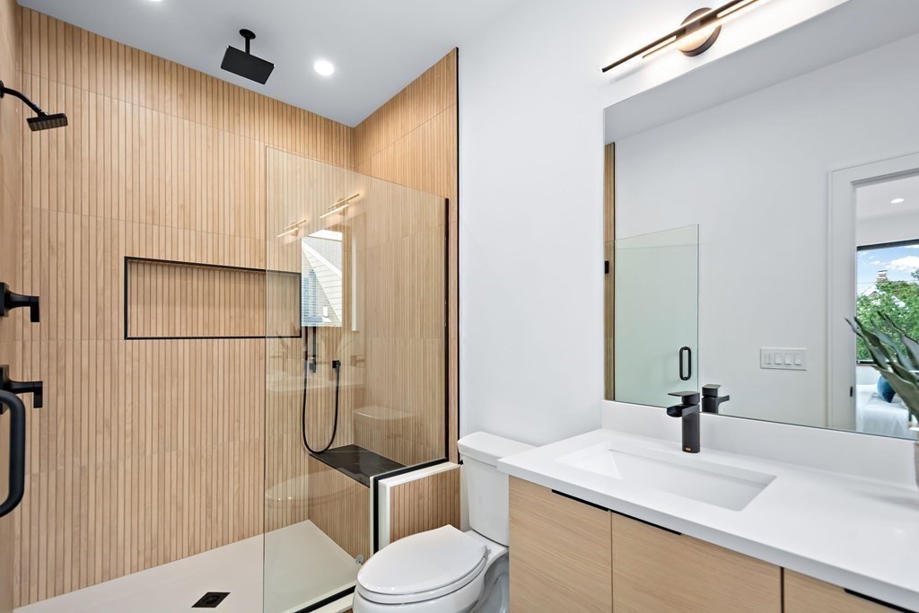 25 Tolman Street, Unit 1 Waltham, MA 02453 - Photo 23 of 36 a bathroom with a sink toilet and shower