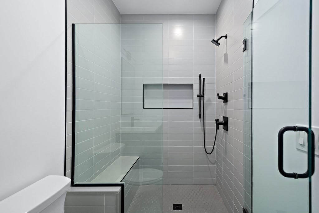 25 Tolman Street, Unit 1 Waltham, MA 02453 - Photo 25 of 36 a bathroom with a shower