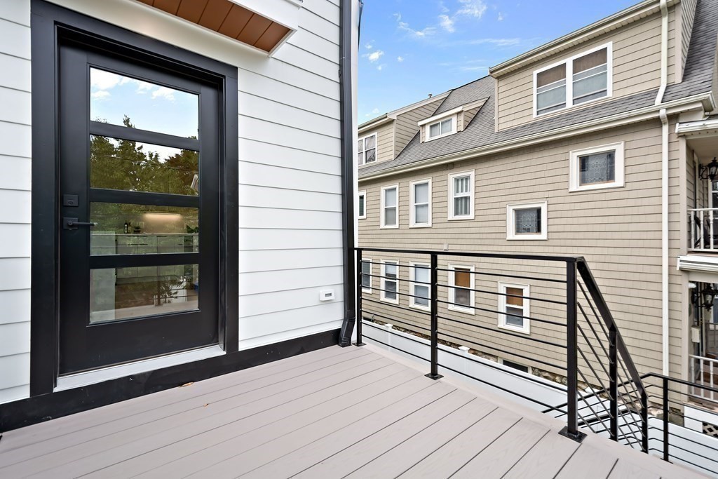25 Tolman Street, Unit 1 Waltham, MA 02453 - Photo 31 of 36 a view of outdoor space and deck