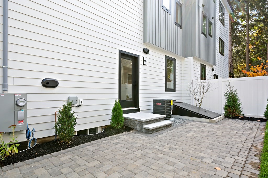 25 Tolman Street, Unit 1 Waltham, MA 02453 - Photo 34 of 36 a view of backyard with sitting area