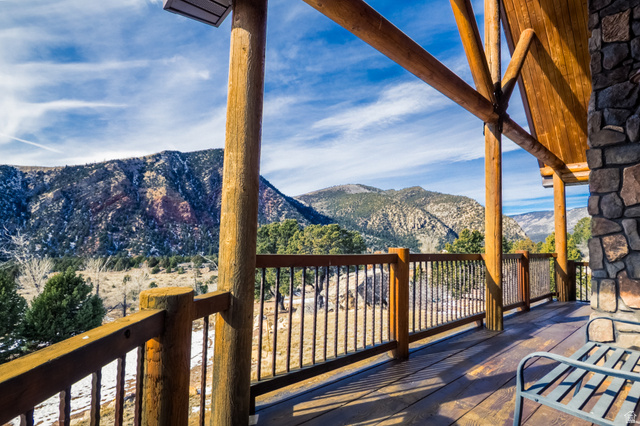 18906 North Canyon Road Whiterocks, UT 84085 - Photo 3 of 65 Wooden deck featuring a mountain view