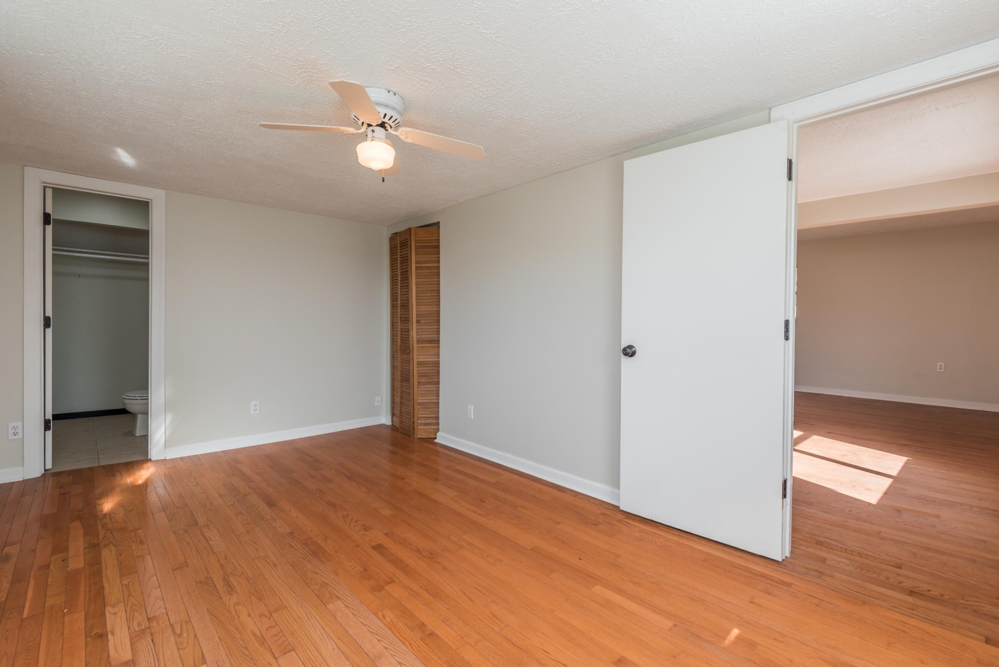 6313 Ridgeview Road Knoxville, TN 37918 - Photo 12 of 33 a view of a livingroom with a ceiling fan and wooden floor