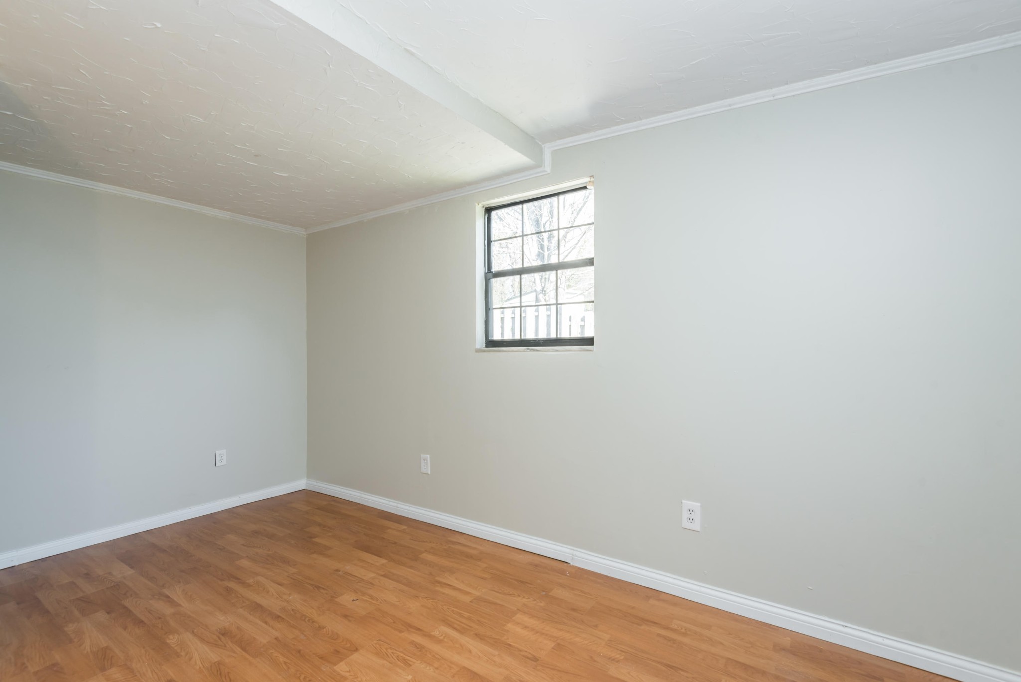6313 Ridgeview Road Knoxville, TN 37918 - Photo 14 of 33 an empty room with wooden floor and windows