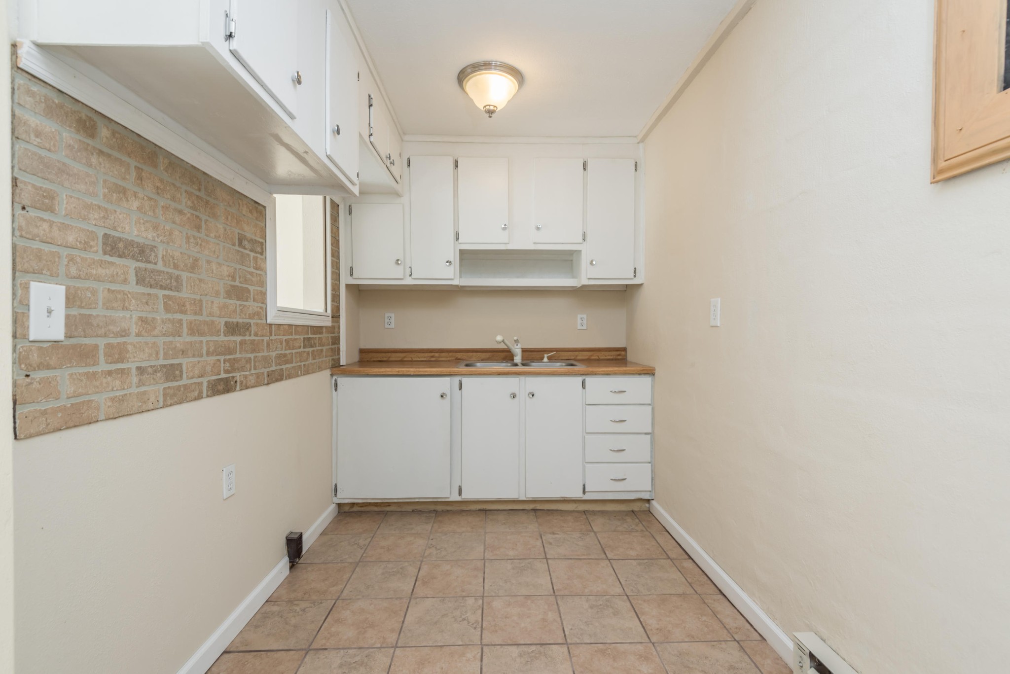 6313 Ridgeview Road Knoxville, TN 37918 - Photo 27 of 33 a kitchen with cabinets and a stove top oven