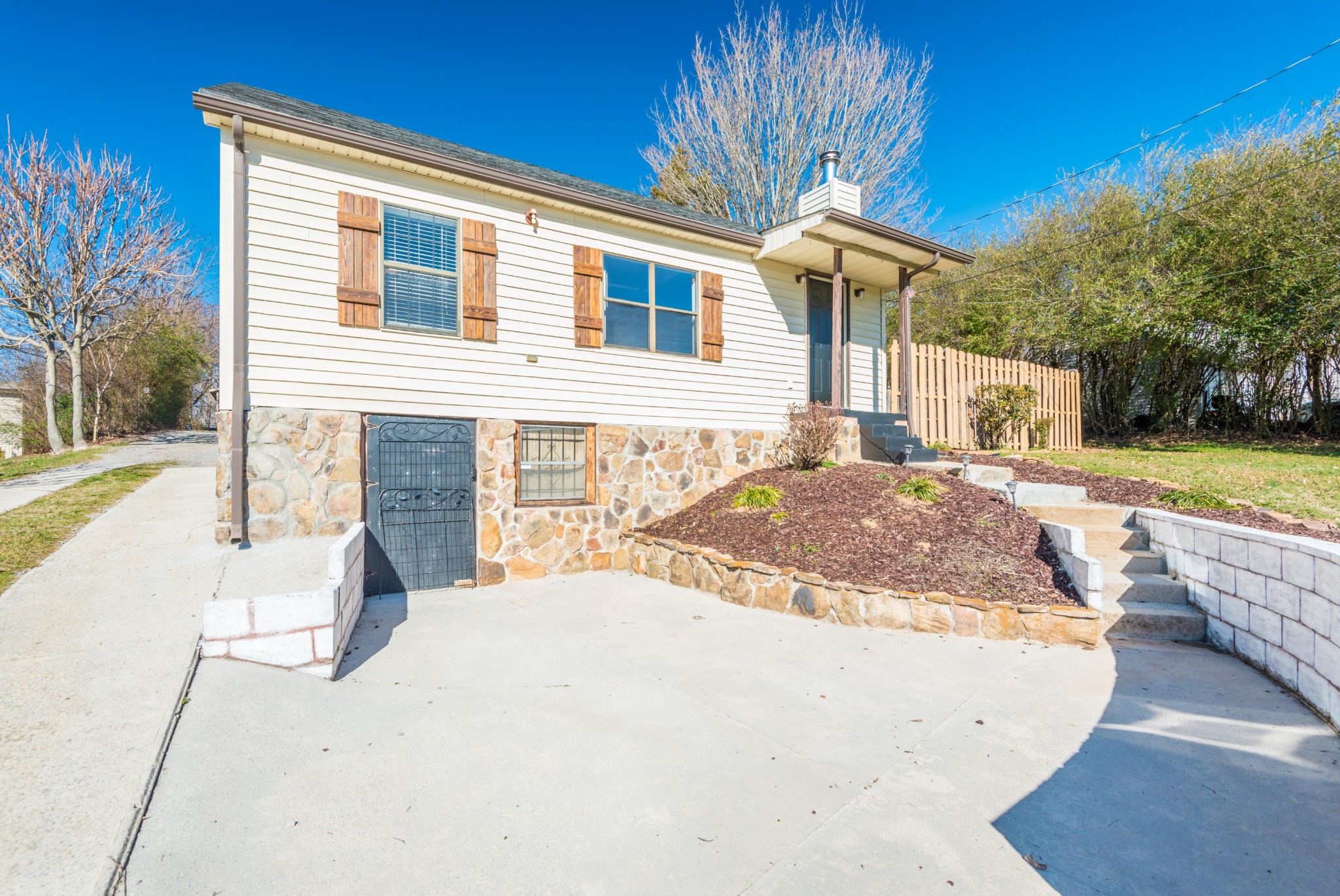 6313 Ridgeview Road Knoxville, TN 37918 - Photo 3 of 33 a view of a house with backyard and sitting area
