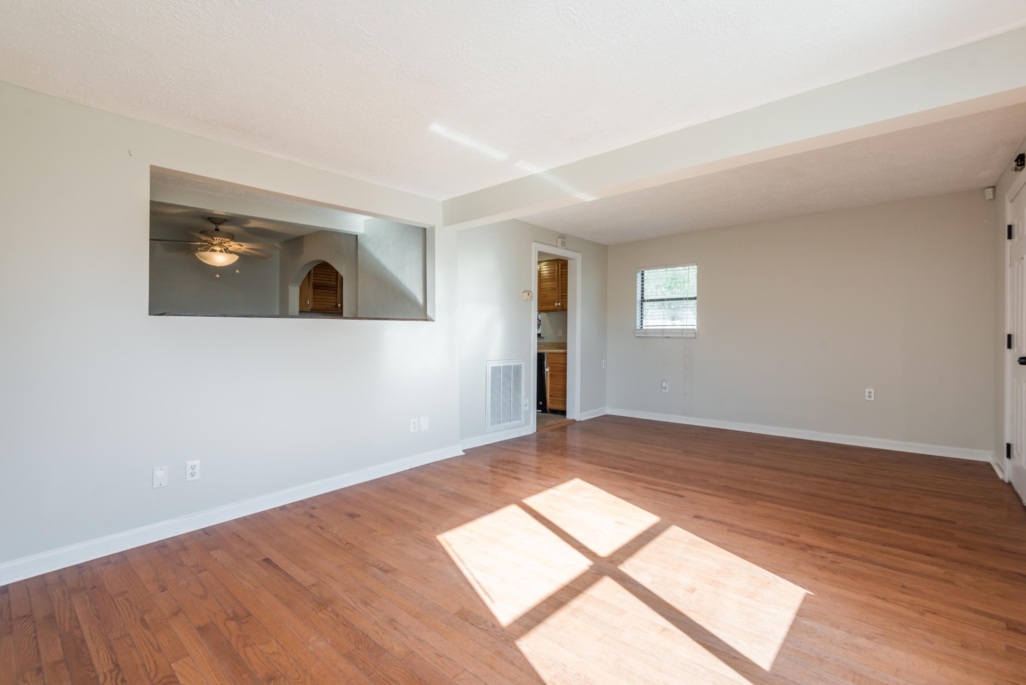 6313 Ridgeview Road Knoxville, TN 37918 - Photo 4 of 33 an empty room with wooden floor and windows