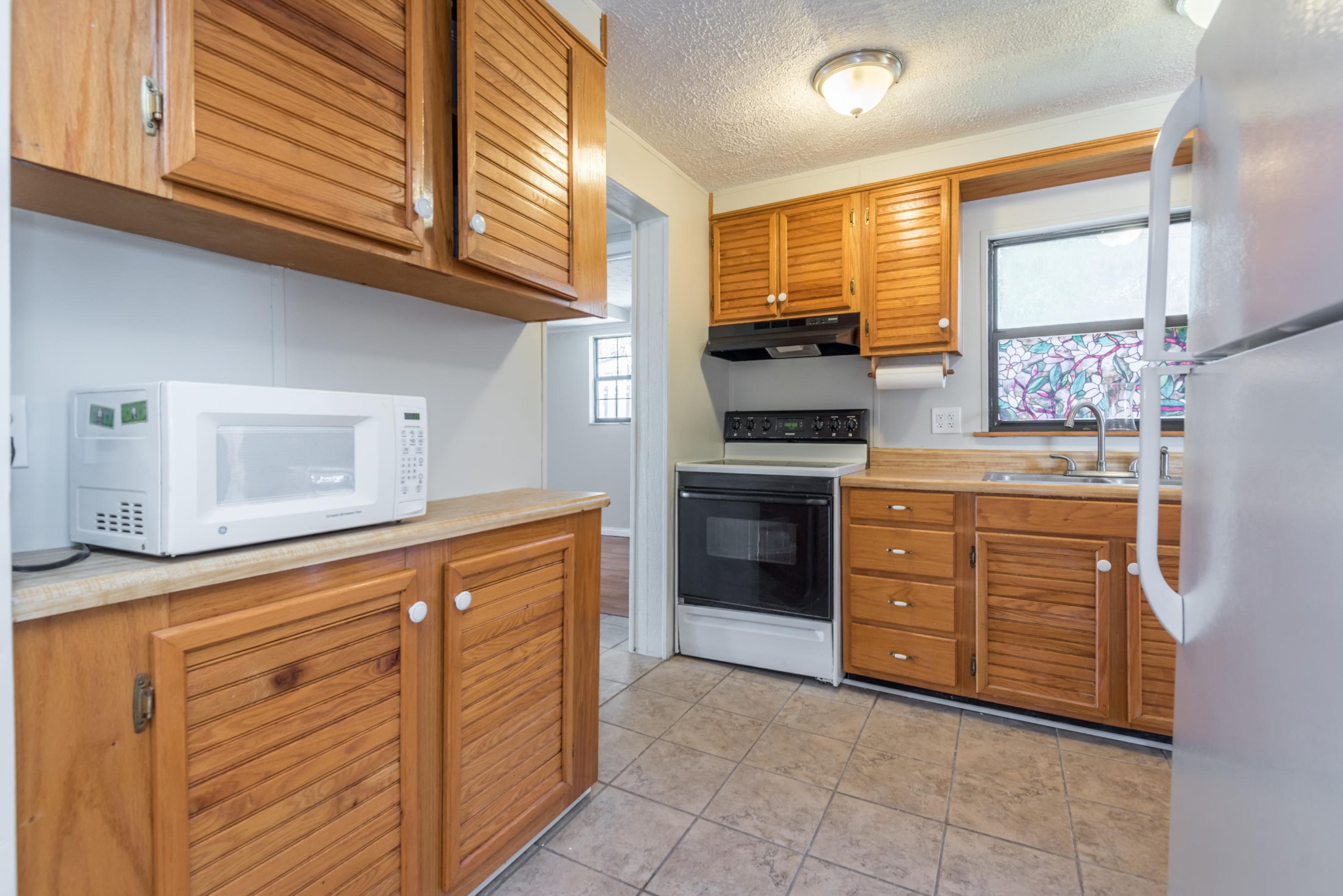 6313 Ridgeview Road Knoxville, TN 37918 - Photo 7 of 33 a kitchen with stainless steel appliances granite countertop a stove and a sink