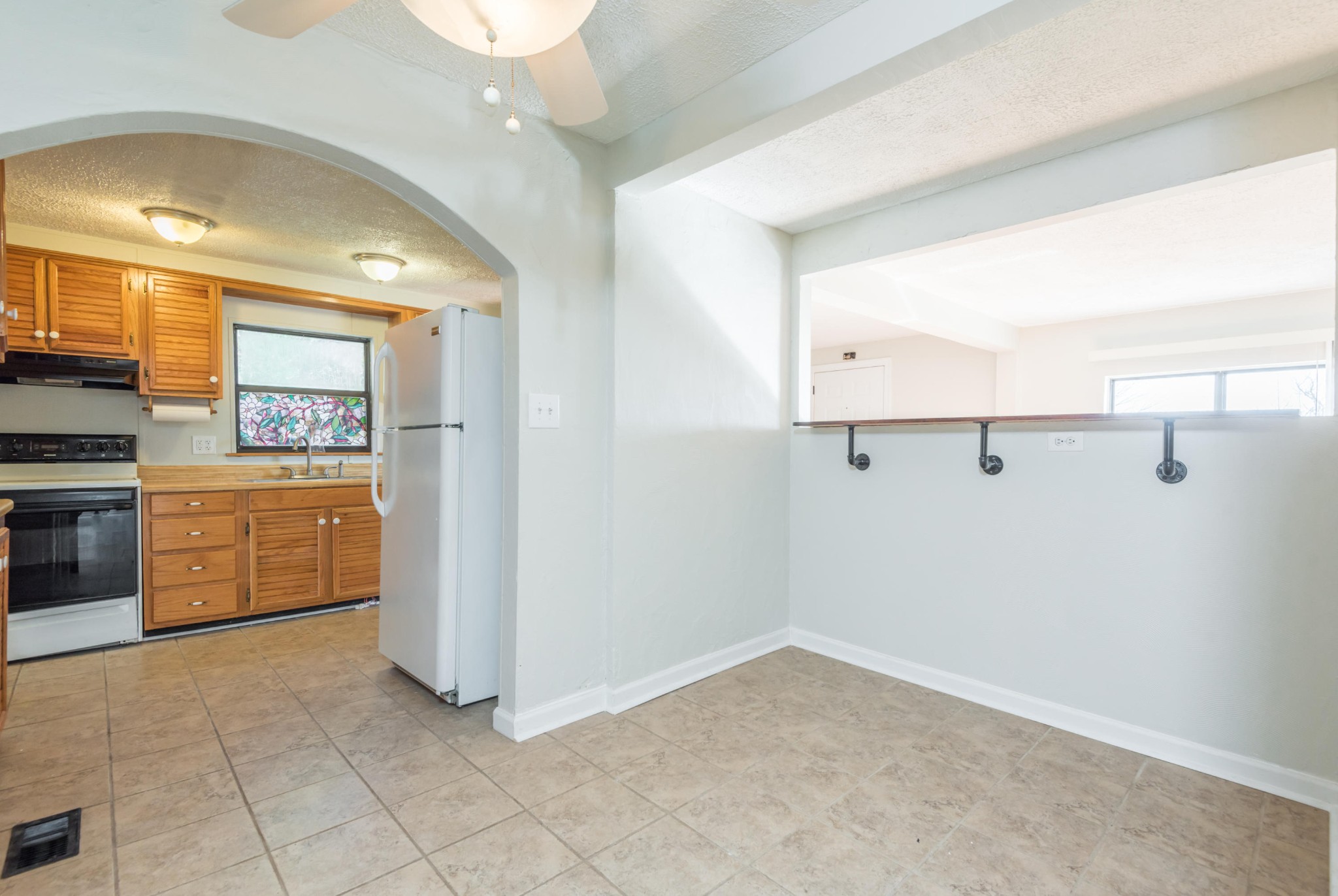 6313 Ridgeview Road Knoxville, TN 37918 - Photo 9 of 33 a view of a kitchen with refrigerator and microwave
