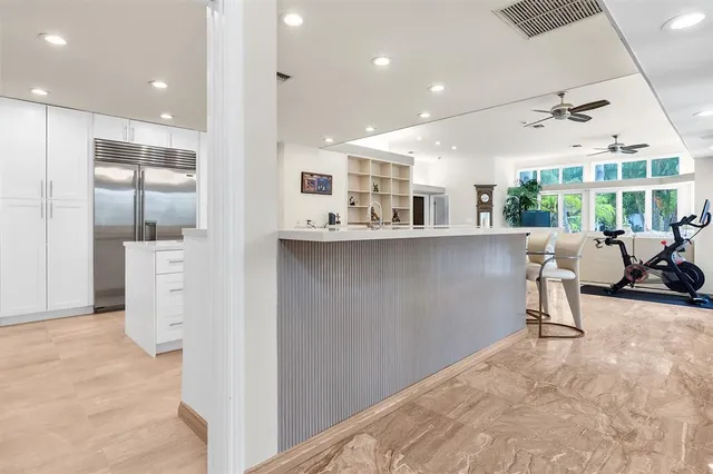 a bed room with a bed and a chair