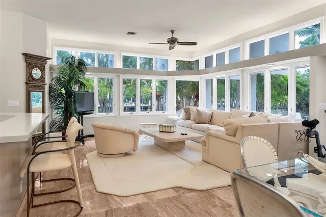 a view of a dining room with furniture window and a chandelier