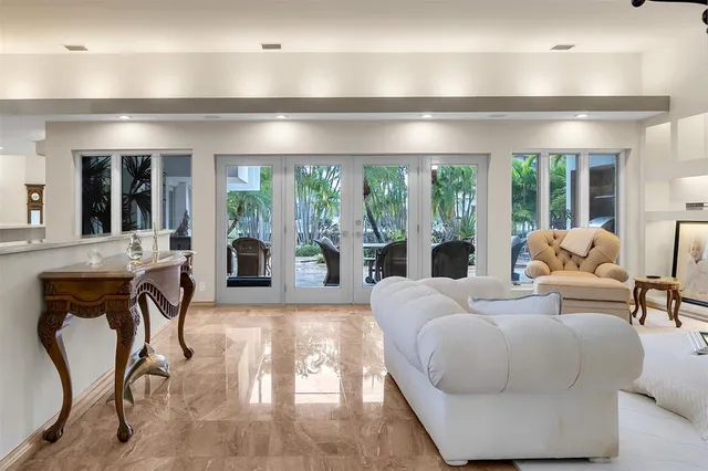 a living room with furniture and a lamp