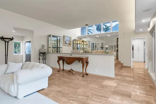 a kitchen with stainless steel appliances granite countertop a sink and a counter top space