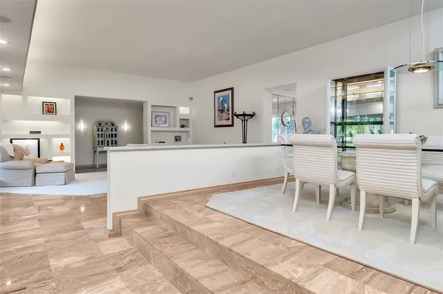 a room with a table and chairs in it