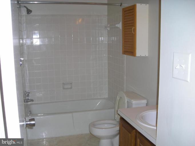 1554 Northgate Square, Unit 54/31B Reston, VA 20190 - Photo 13 of 15 a bathroom with a sink and toilet