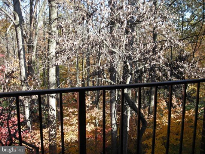 1554 Northgate Square, Unit 54/31B Reston, VA 20190 - Photo 15 of 15 a view of a balcony with wooden floor and fence