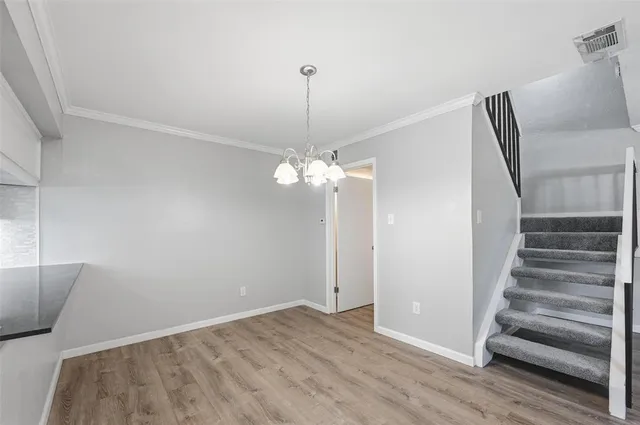 a view of a livingroom with a ceiling fan and window