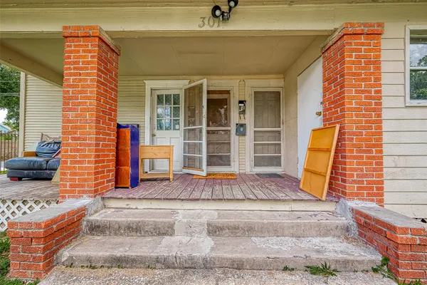 a front view of a house with large windows