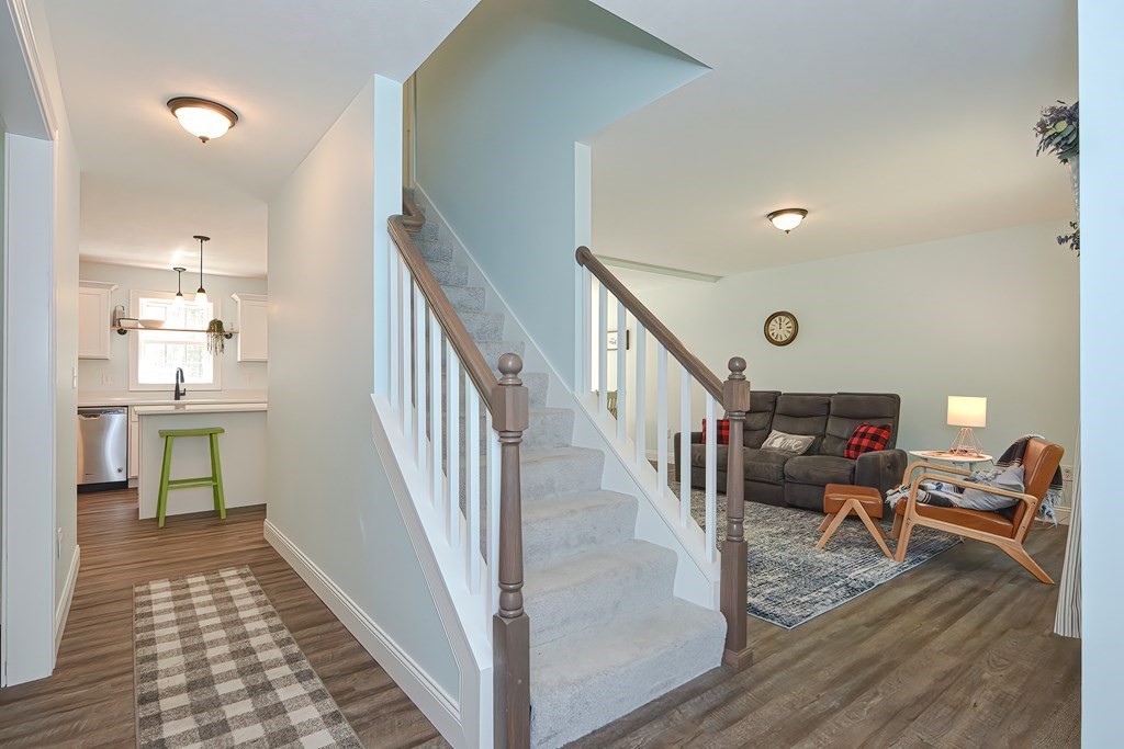 10 Colony Road Phillipston, MA 01331 - Photo 17 of 36 a view of a hallway with wooden floor and staircase