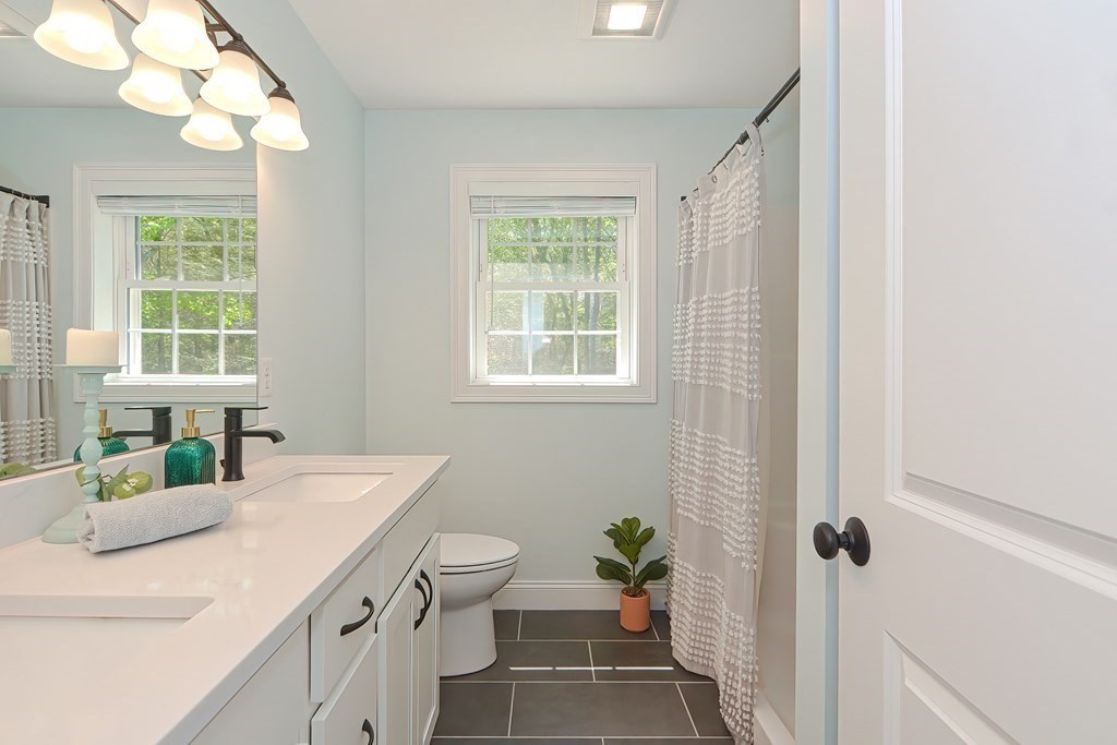 10 Colony Road Phillipston, MA 01331 - Photo 20 of 36 a bathroom with a sink a toilet and a mirror