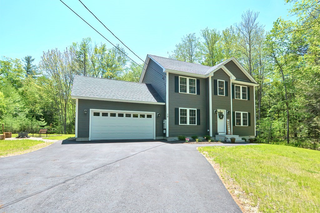 10 Colony Road Phillipston, MA 01331 - Photo 2 of 36 a front view of a house with a yard and trees