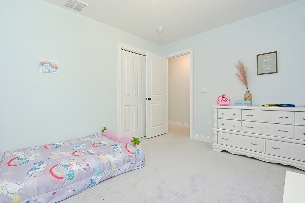 10 Colony Road Phillipston, MA 01331 - Photo 24 of 36 a bedroom with a bed and a dresser