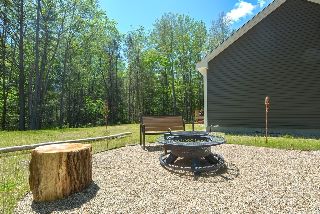 10 Colony Road Phillipston, MA 01331 - Photo 34 of 36 a view of a backyard with plants and a patio