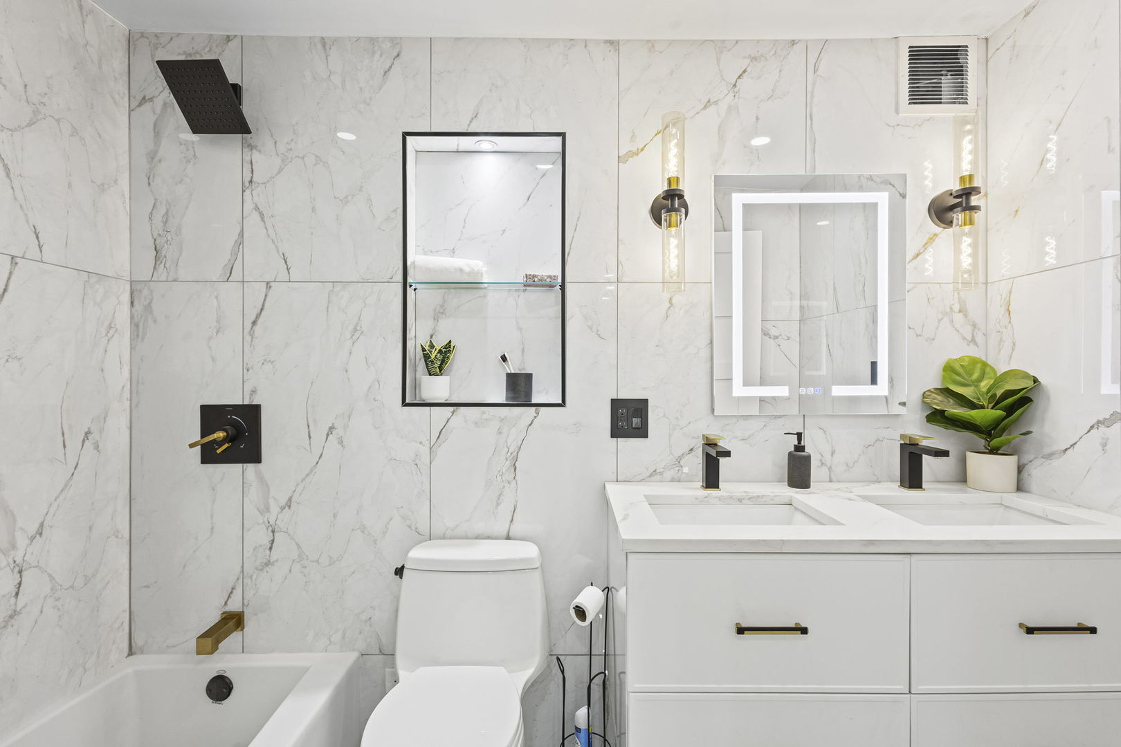 100 East Walton Street, Unit 14D Chicago, IL 60611 - Photo 23 of 36 a bathroom with a sink toilet and shower