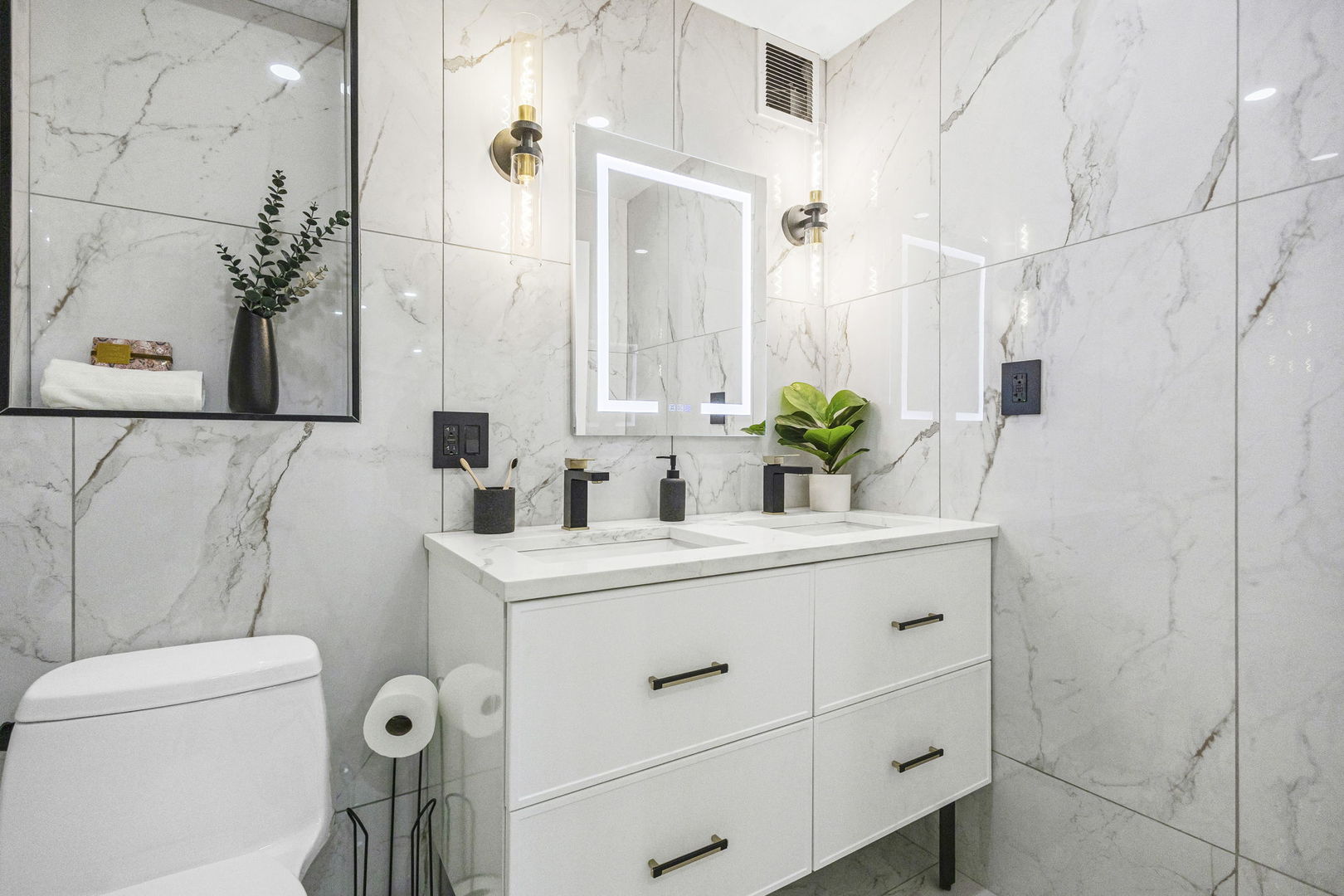 100 East Walton Street, Unit 14D Chicago, IL 60611 - Photo 26 of 36 a bathroom with a sink and mirror