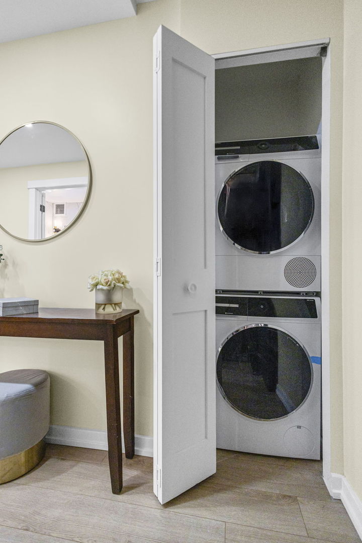 100 East Walton Street, Unit 14D Chicago, IL 60611 - Photo 27 of 36 a close up view of a washer and dryer