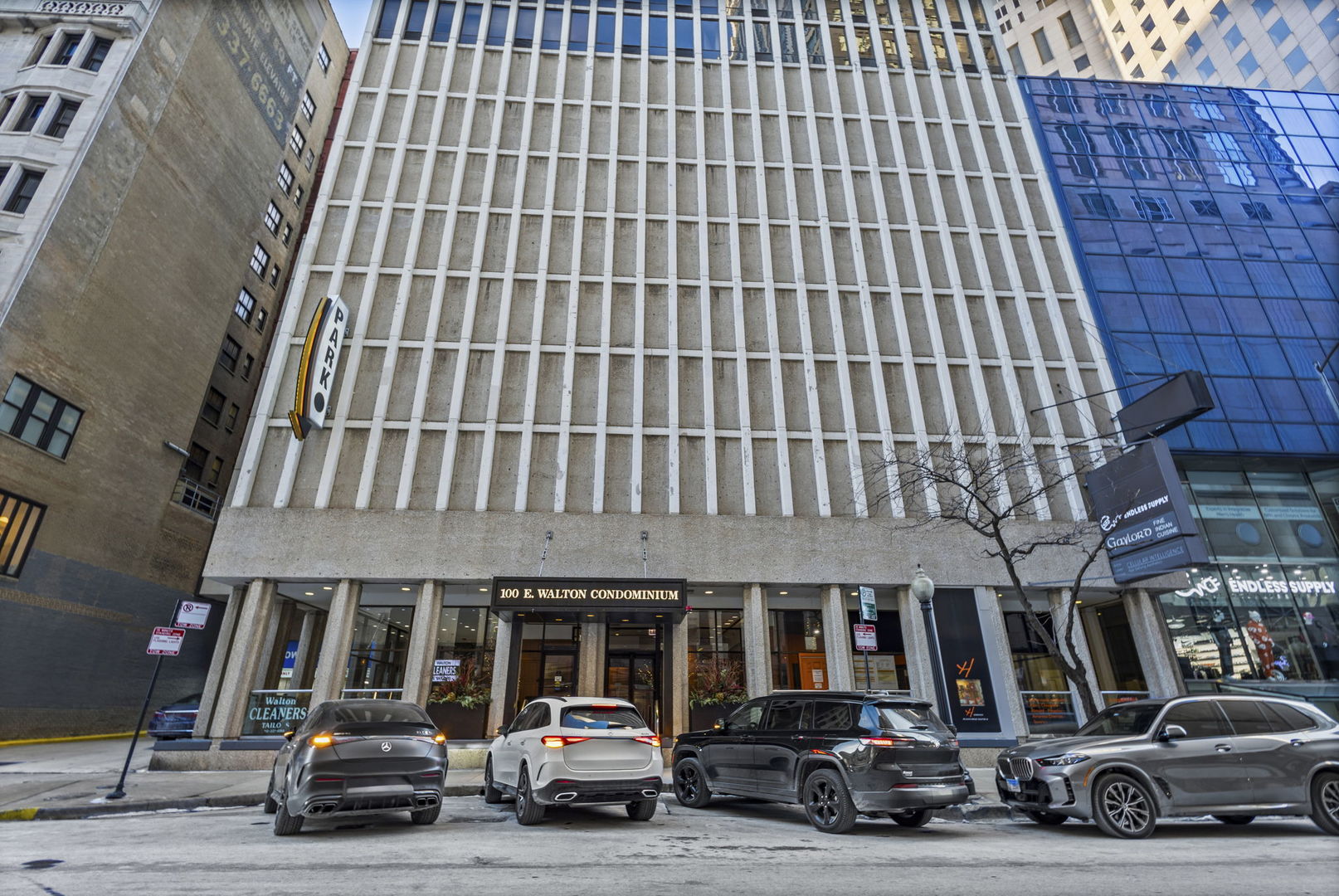 100 East Walton Street, Unit 14D Chicago, IL 60611 - Photo 28 of 36 a car parked in front of a building