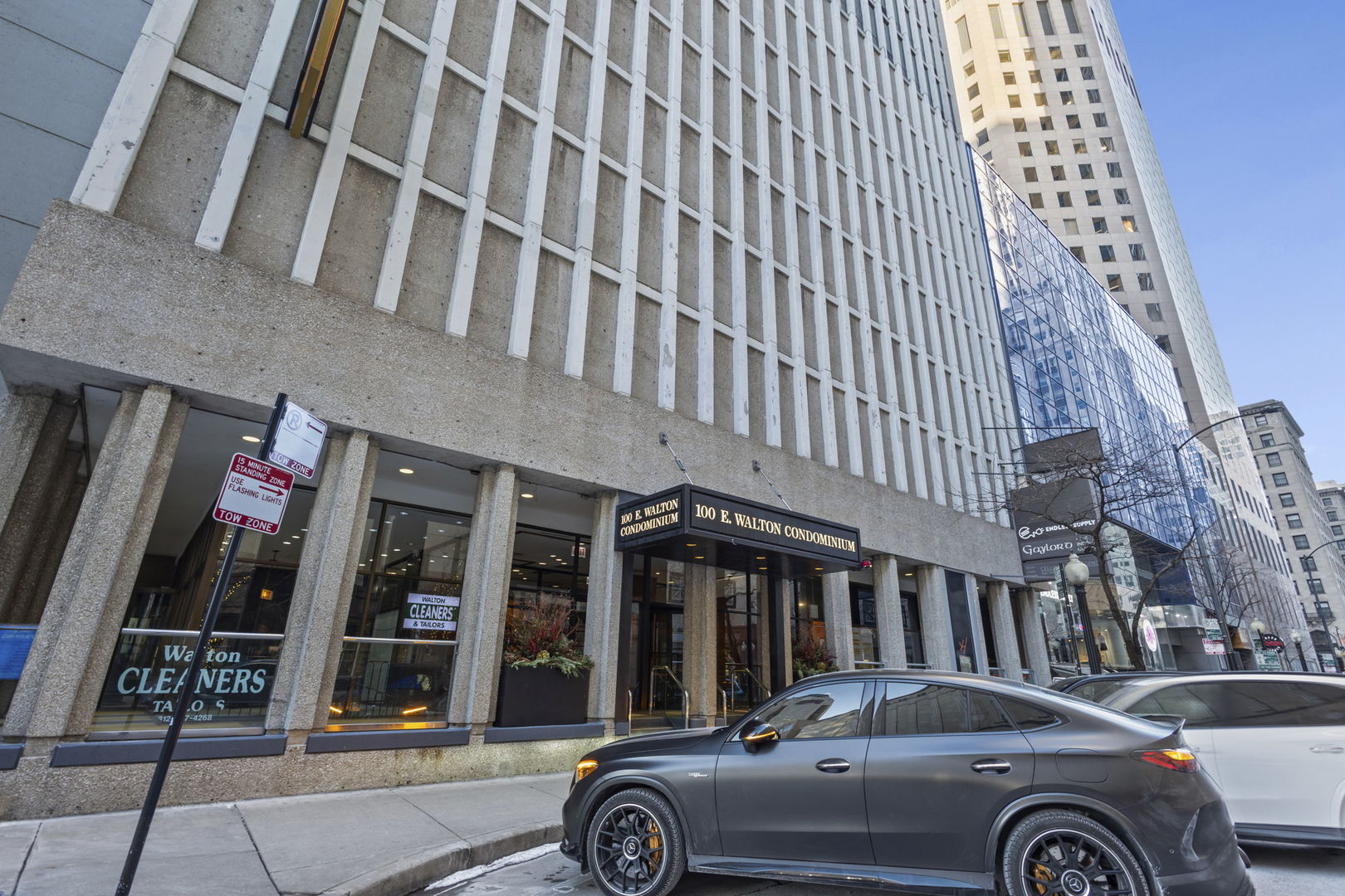 100 East Walton Street, Unit 14D Chicago, IL 60611 - Photo 29 of 36 a front view of a building with parking space