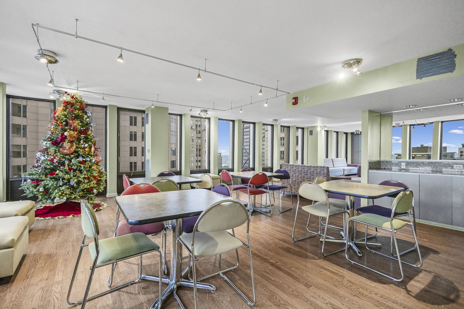 100 East Walton Street, Unit 14D Chicago, IL 60611 - Photo 35 of 36 a view of a dining room with furniture window and wooden floor