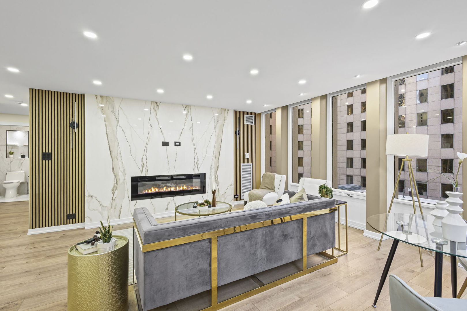 100 East Walton Street, Unit 14D Chicago, IL 60611 - Photo 6 of 36 a large kitchen with stainless steel appliances a large counter top a stove a sink and a refrigerator