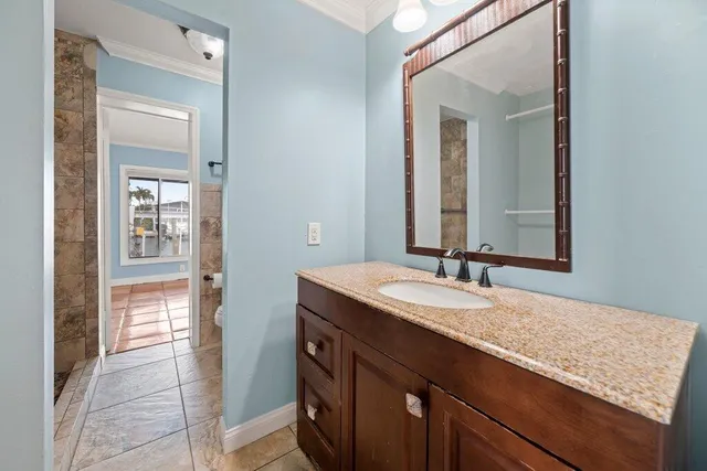 a view of a room with wooden floor and door