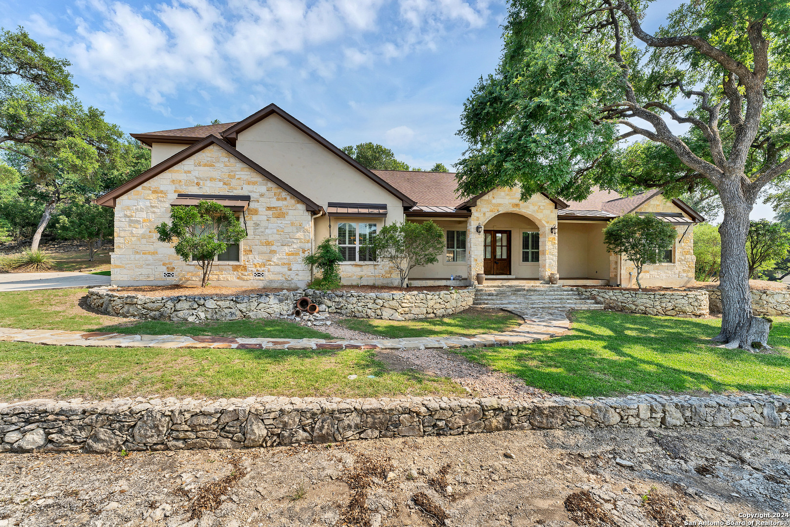 a front view of a house with a yard