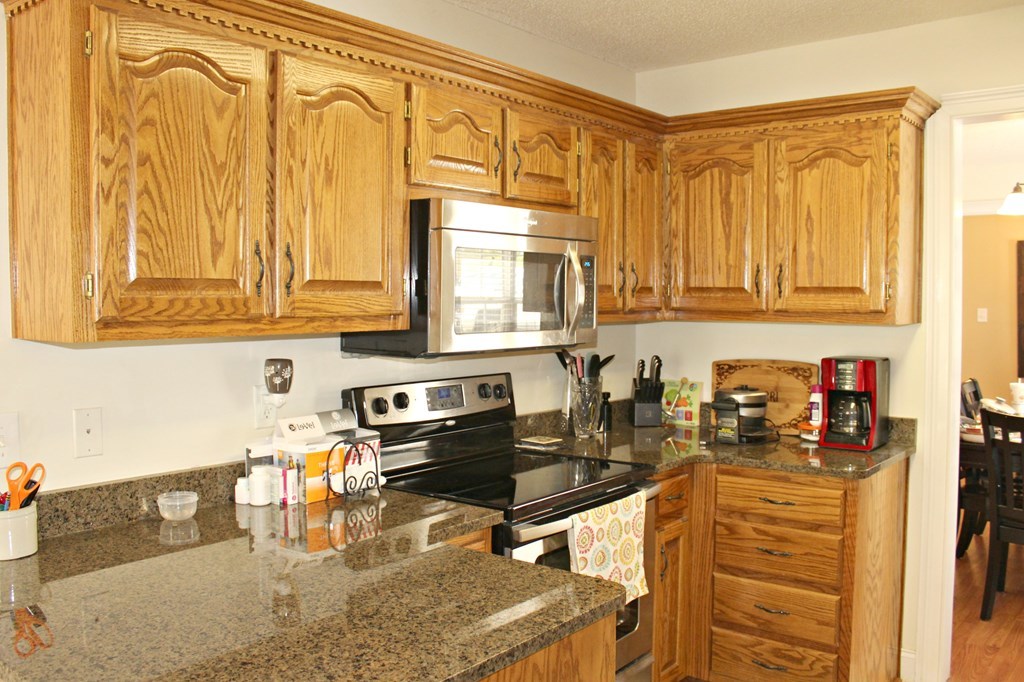 318 Lee King Road Forsyth, GA 31029 - Photo 4 of 8 a kitchen with sink a window and cabinets