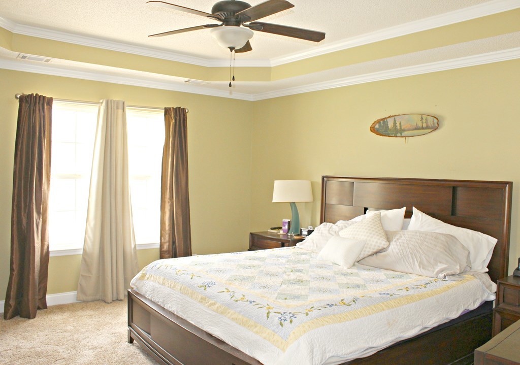 318 Lee King Road Forsyth, GA 31029 - Photo 7 of 8 a bedroom with a bed and a window