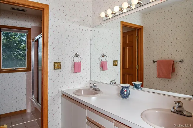 a bathroom with a sink and a mirror