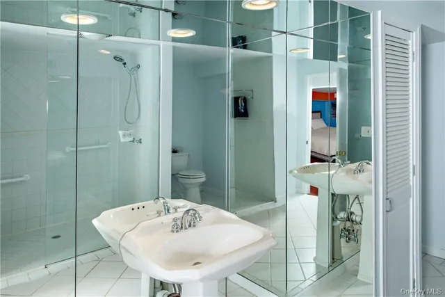 a bathroom with a sink and shower